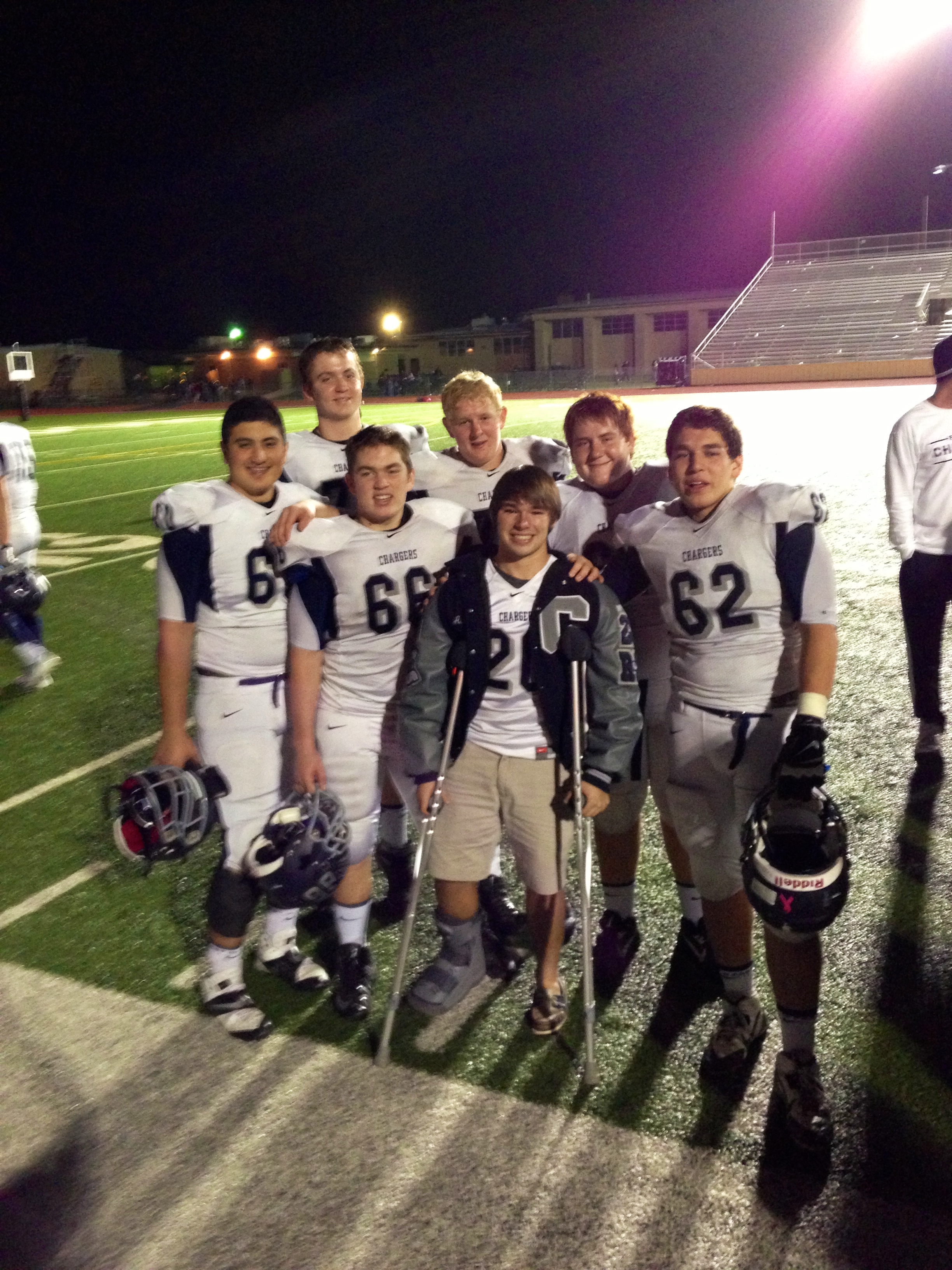 Austin Humphrey on crutches with teammates