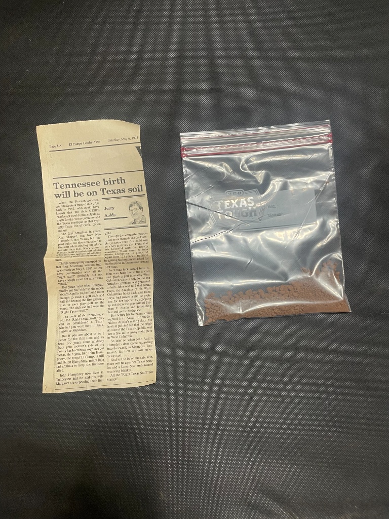 The original Texas soil from West Columbia and newspaper clipping from 1995