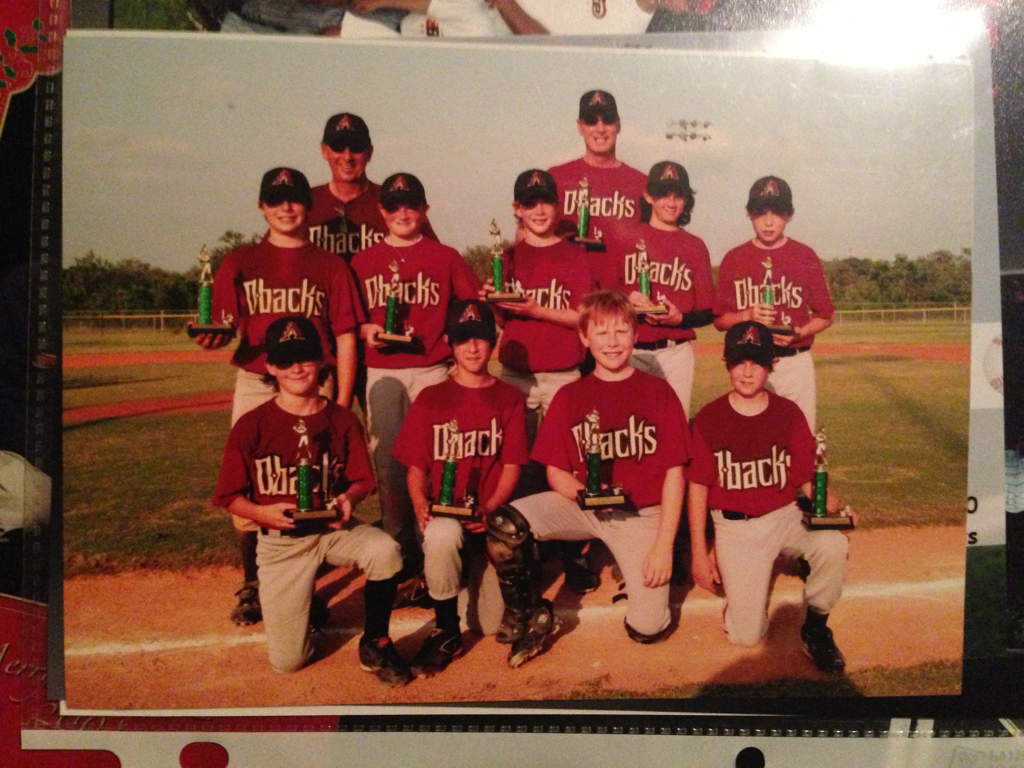 Austin's youth D-backs team with trophies